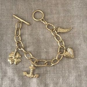 Gold tone charm bracelet.